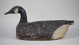 Early Canada goose by an unknown Crisfield, Maryland decoy maker, ca. 1920. Carved wing delineation and carved eyes. E.C. Dize is painted on the bottom. Wonderful piece of Eastern Shore folk art.