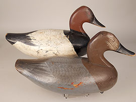 Early hand-copped pair of canvasbacks by Jess Urie of Rock Hall, Maryland. "IDS" stamped into the weight for I.D. Shapiro, who owned a steel foundry in Baltimore. 