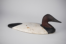 Wooden canvasback wing duck from the Griff Sinclair gunning rig in excellent original paint, ca. 1920, formerly in the collection of Norris Pratt.
