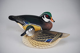 Pair of miniature wood ducks by Charlie Joiner of Chestertown, Maryland, signed and dated 1976. 
