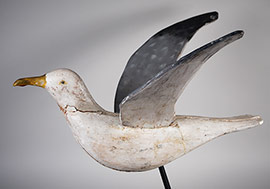 Large extended-wing seagull, possibly used as a porch or dockside ornament, Cape Cod origin, early 20th century, mounted on a contemporary metal stand. A tremendous piece of Americana folk art.